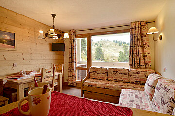 A living room with a couch that has the word chamonix on it