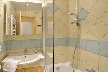 A bathroom with a sink and a bathtub