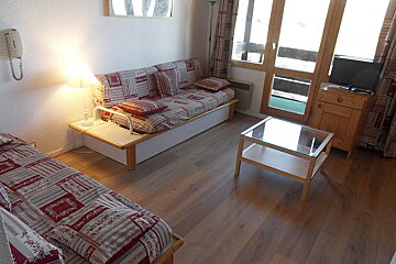 A living room with a couch and a coffee table