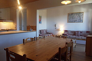 A living room with a couch and a table