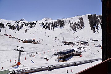 A view of a ski resort from a balcony