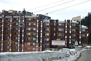 A building with a sign that says plaigne bellecote on it