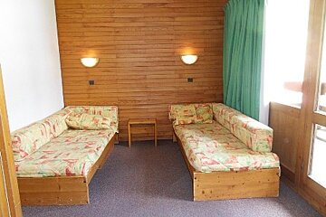 A living room with two couches and a table