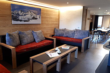 A living room with a couch and two coffee tables