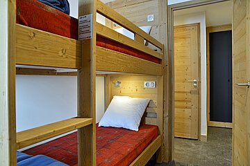 A bunk bed with a sign on it that says ' a ' on it
