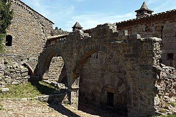 a photo of an old building and archway