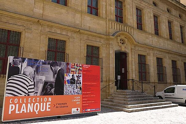 image of a large house with a billboard