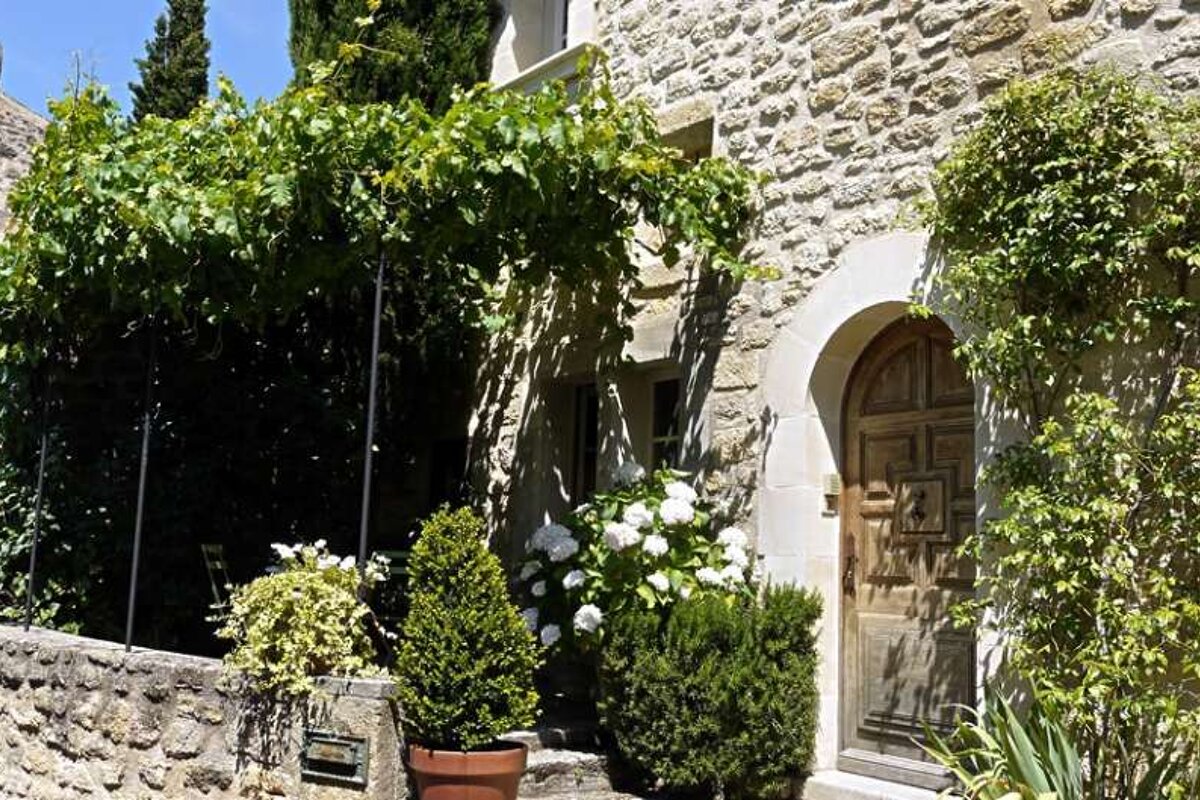 a photo of a stone house and garden