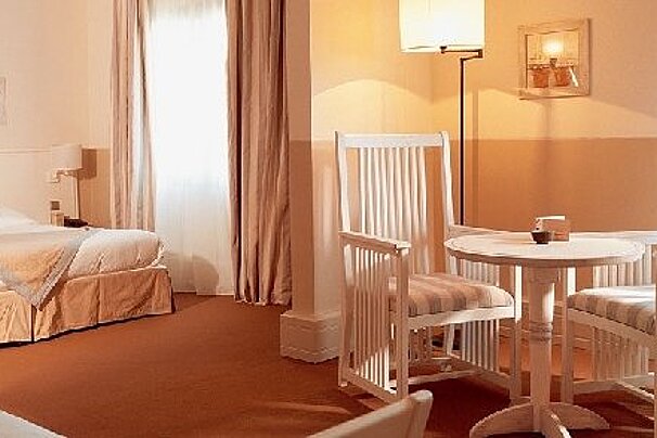 photo of Aquabella Hotel bedroom