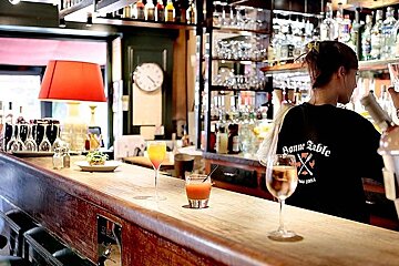 photo of a bar area and bar tender