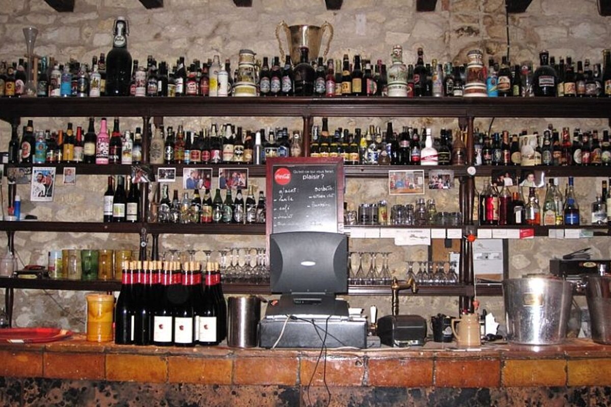 photo of a bar with bottles of alcohol