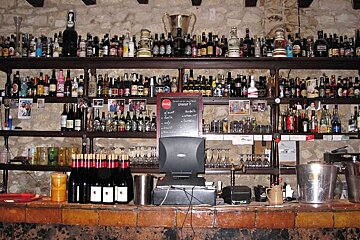 photo of a bar with bottles of alcohol