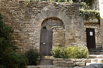 an image of a door and lane in provence