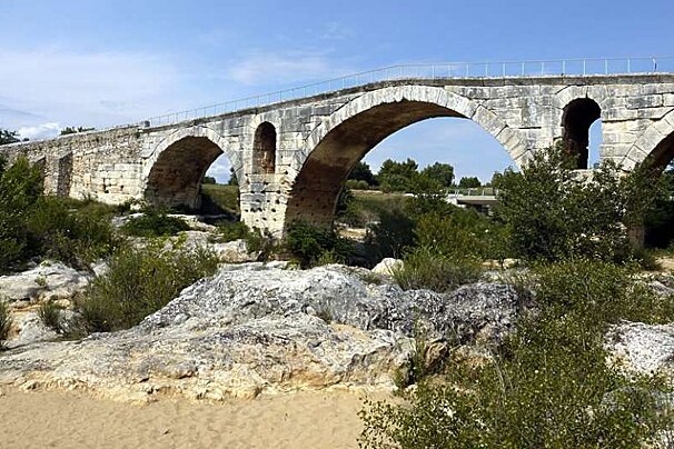 an image of a roman arched brigde in provence