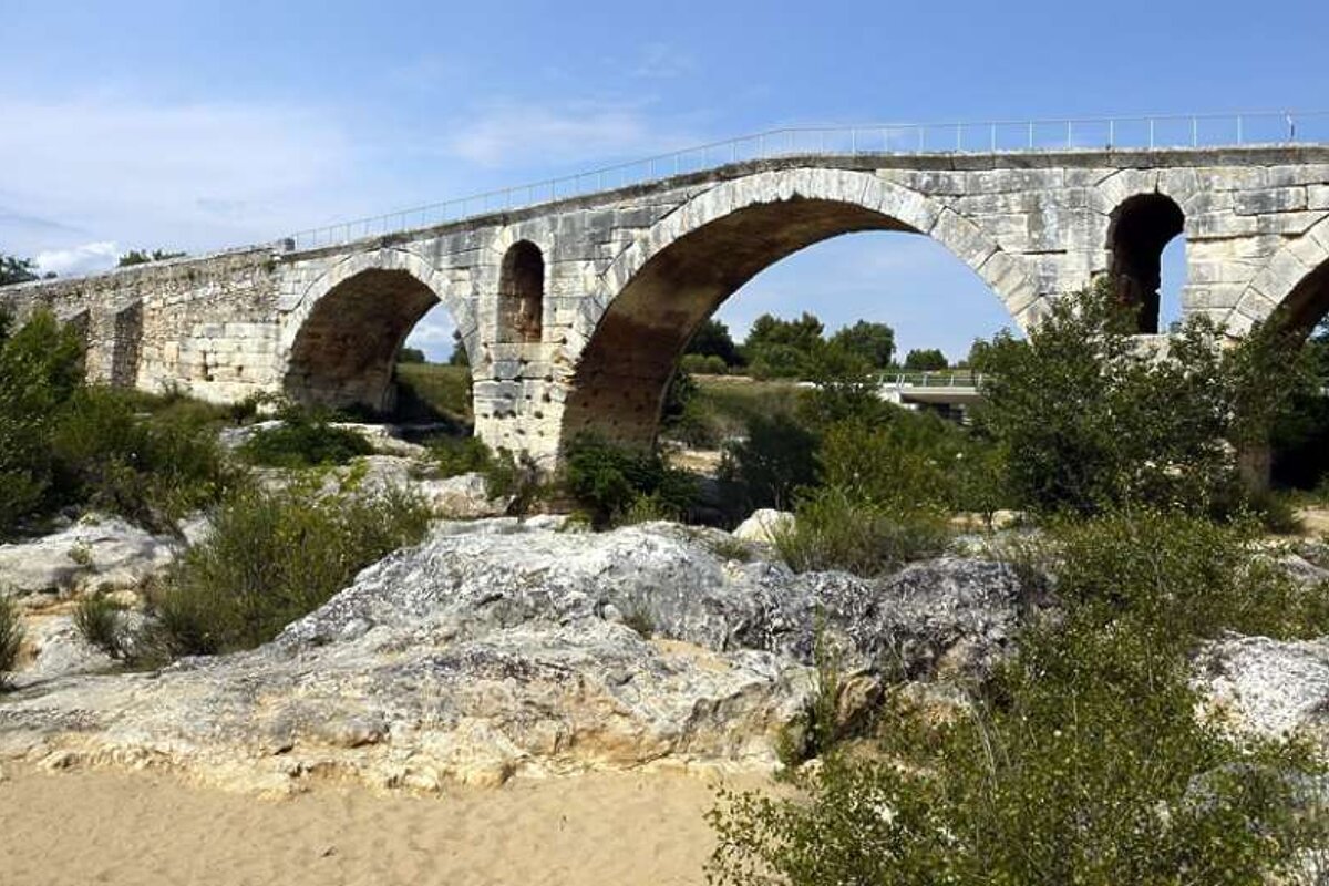 an image of a roman arched brigde in provence