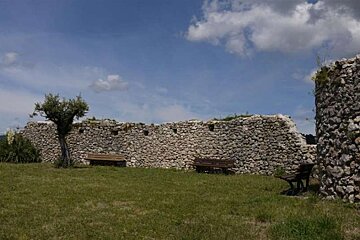 a photo of a castle wall and grass