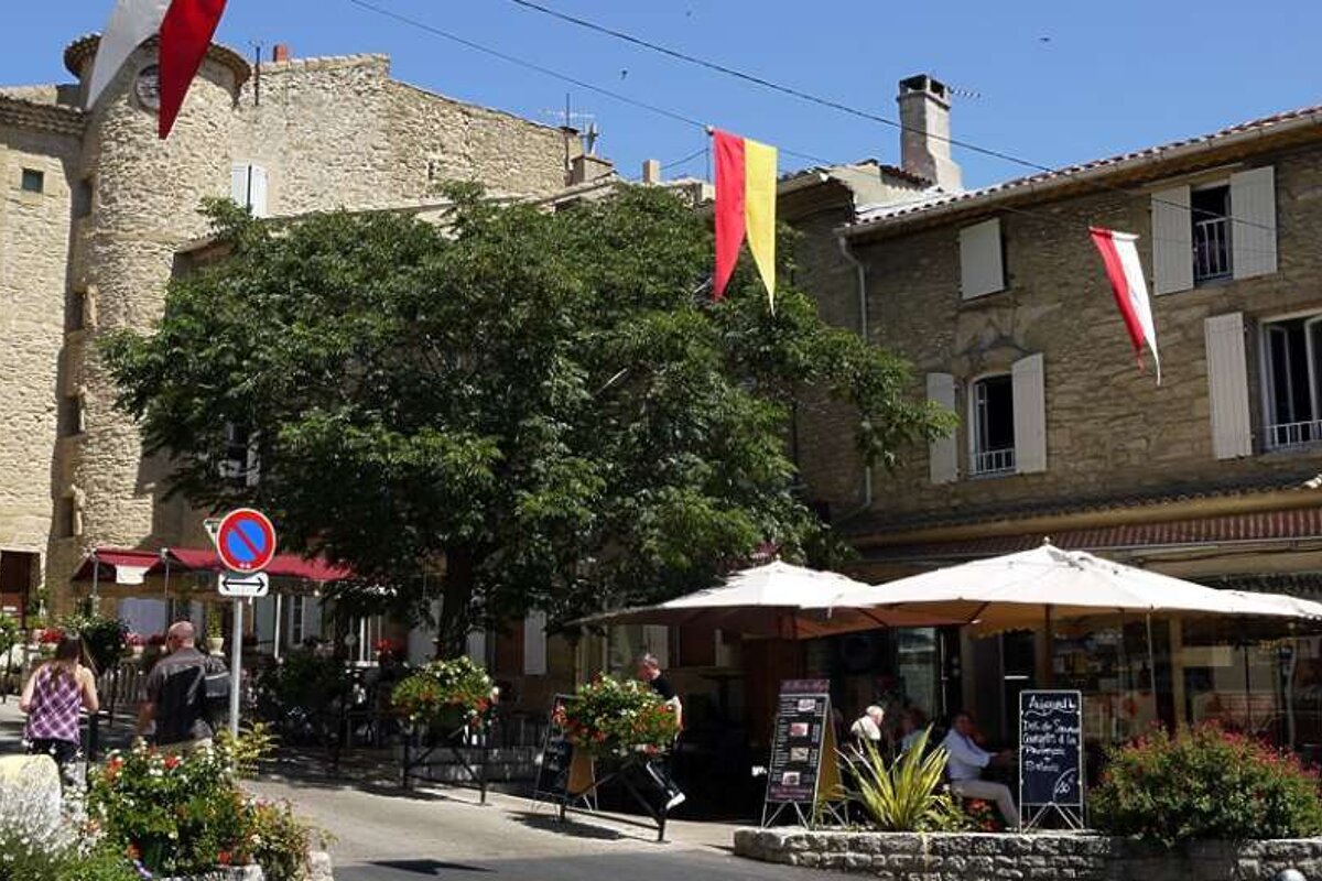 an image of a restaurant with shady terraces