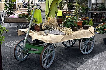 a photo of a four wheeled wheelbarrow