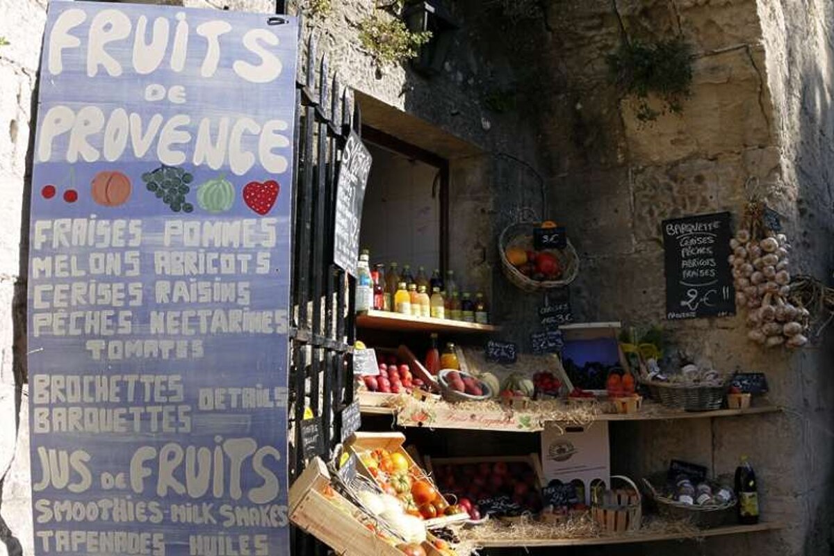 a photo of local fruits and a sign