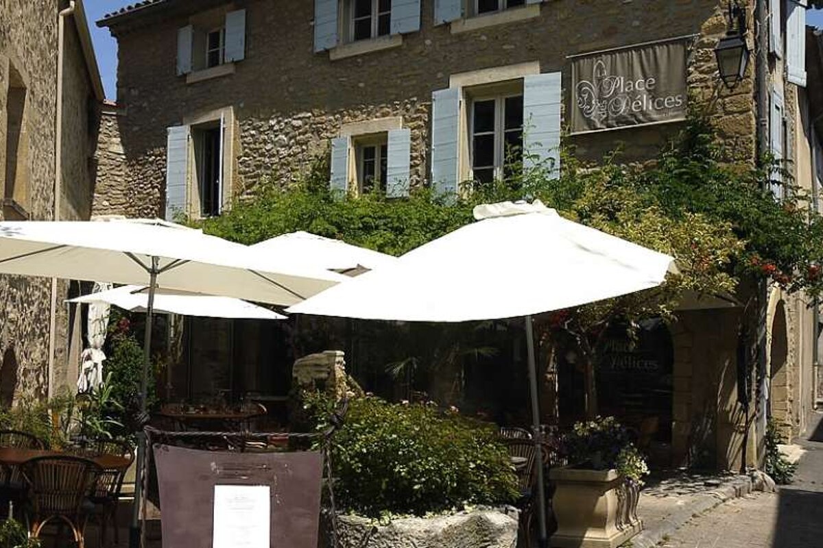 a photo of parasols in a cafe terrace