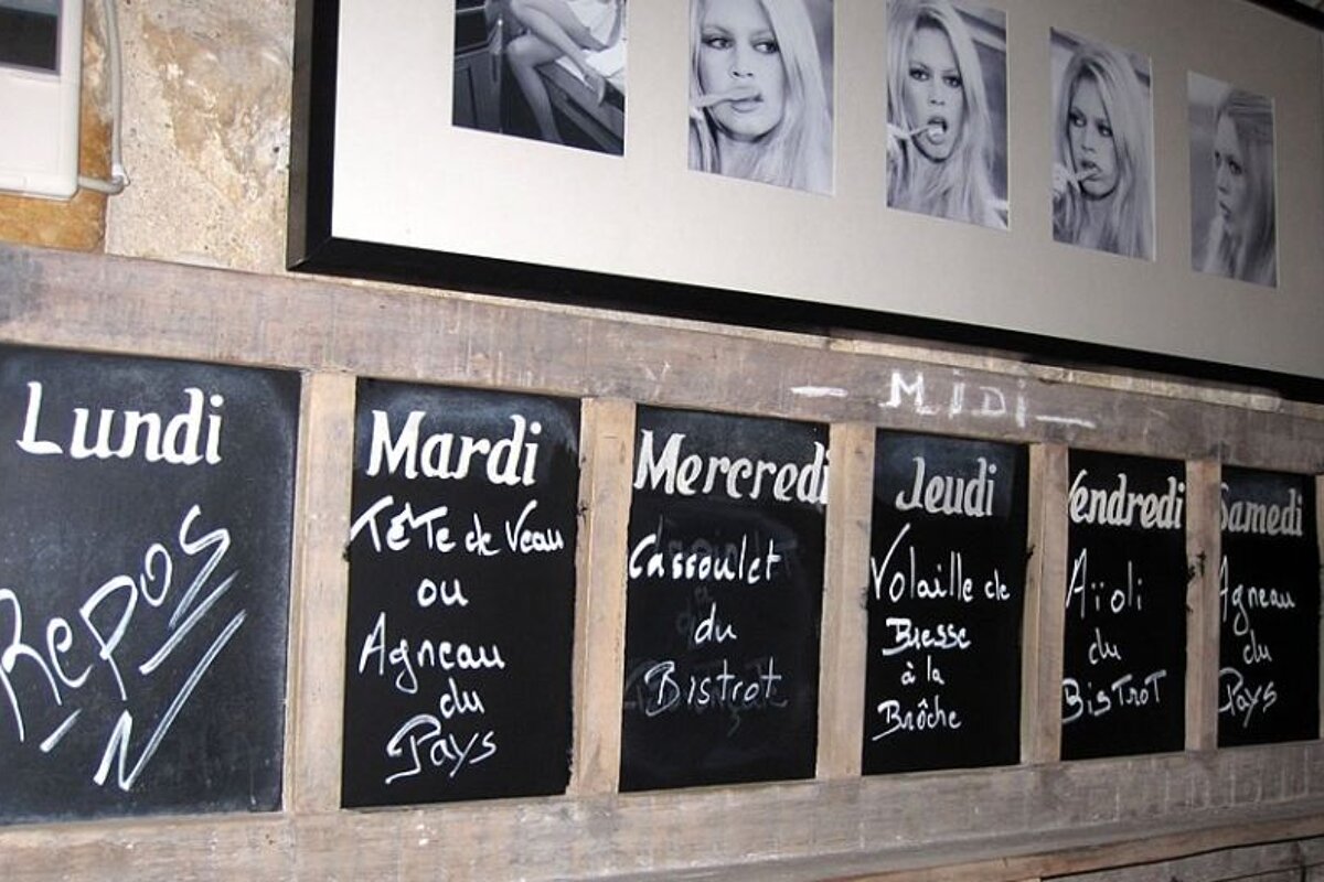 photo of blackboards on a stone wall