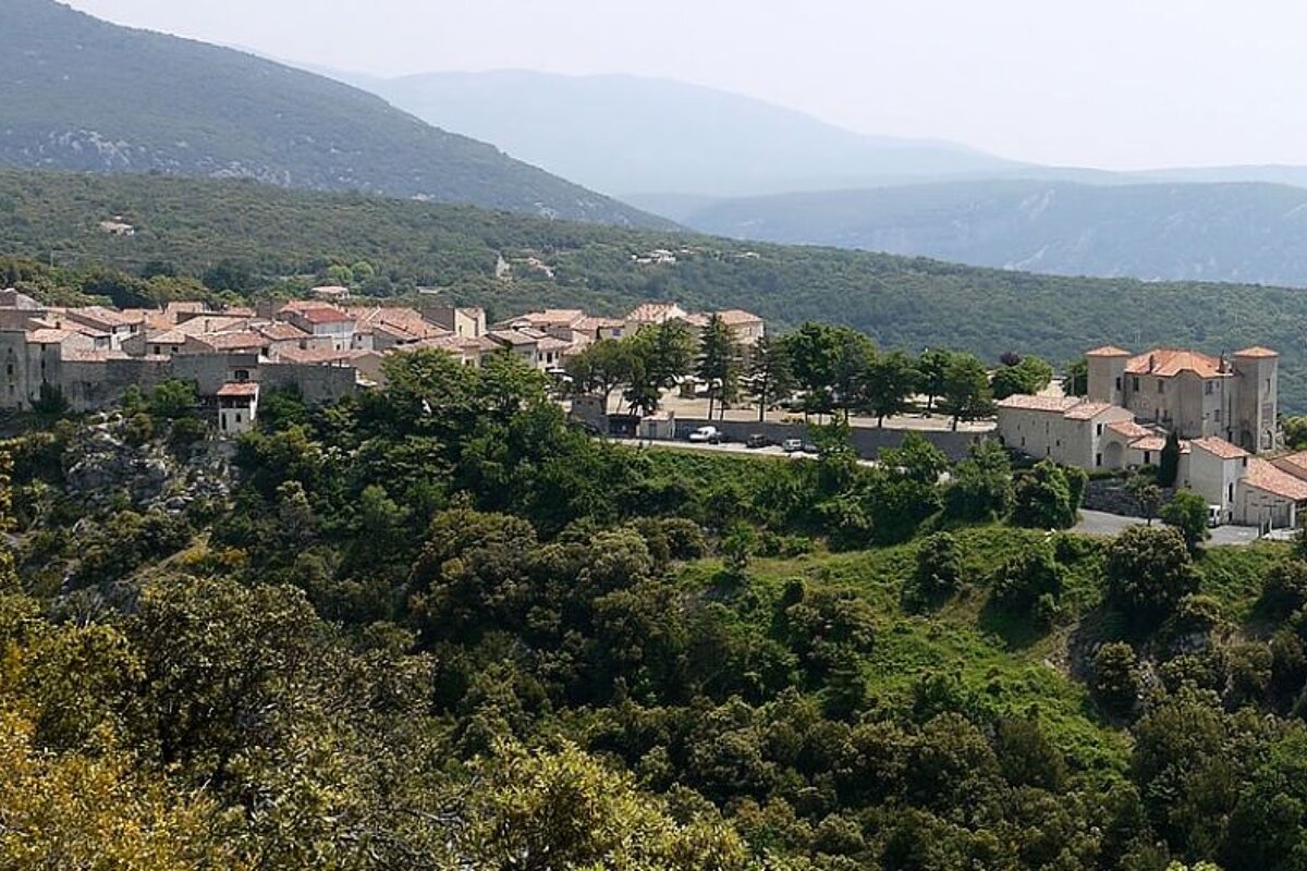 photo of a village in green hills