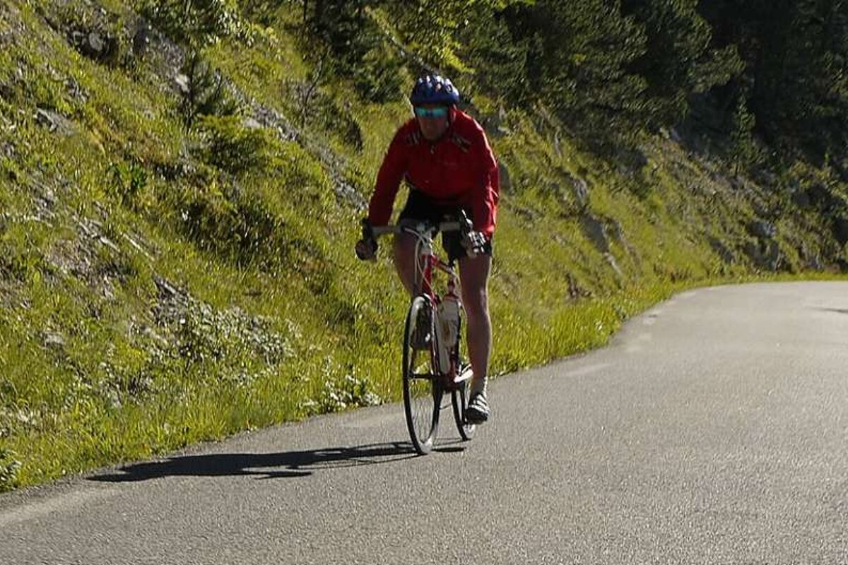 a photo of cyclist on a road