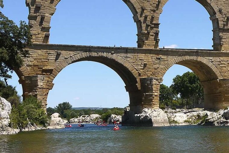 a photo of a river and a bridge