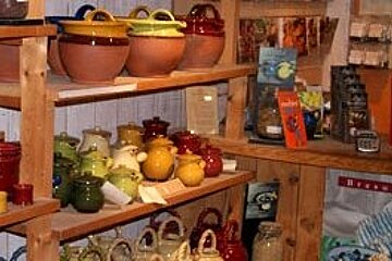 Colourful pottery on shelves
