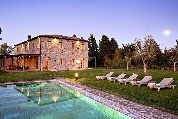 villa with pool and sun loungers