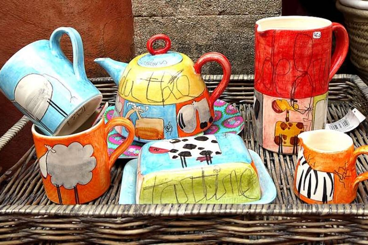 a photo of a colourful tea set