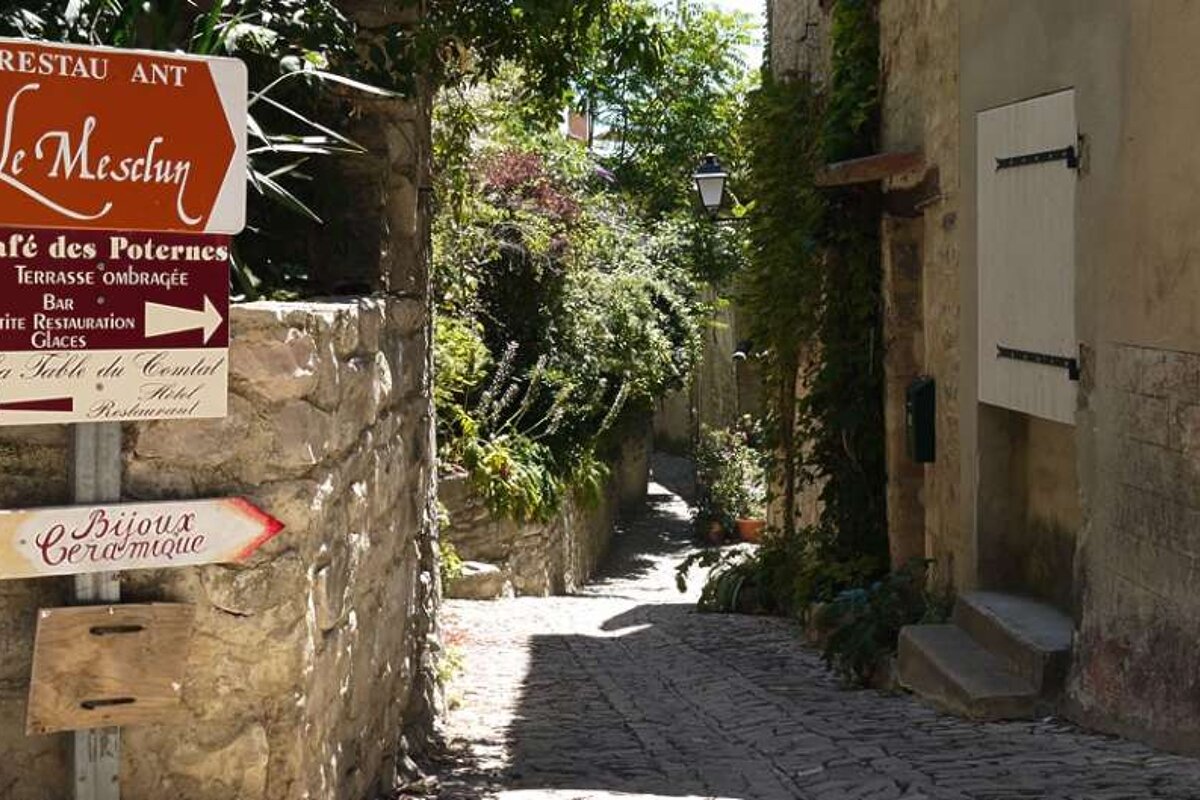 a photo of a lane with sign posts