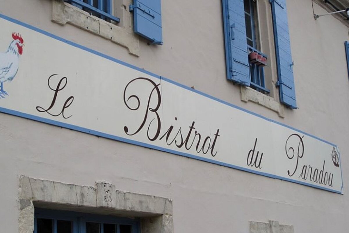 photo of a restaurant sign on a wall