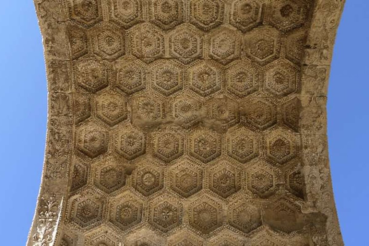 photo of the inside of a stone arch