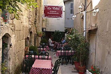 photo of dining tables in an alley