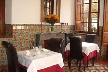 an image of some tables and chairs in a restaurant