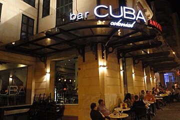 Photo of night bar and street people drinking