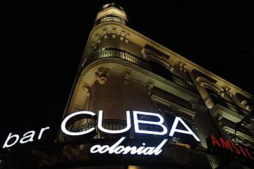 Photo looking up at bar at night