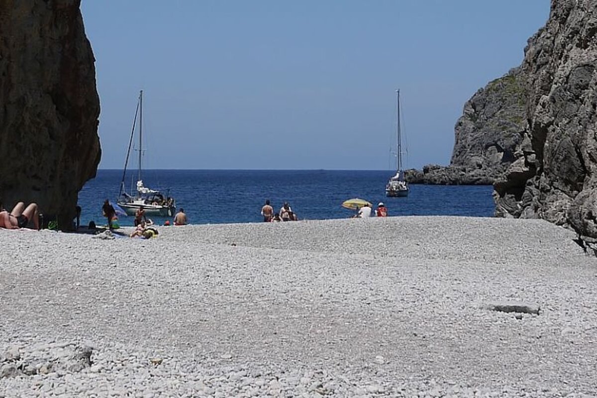 photo of a pebble beach and the sea