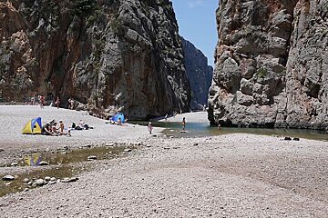 photo of a pebble beach and cliffs