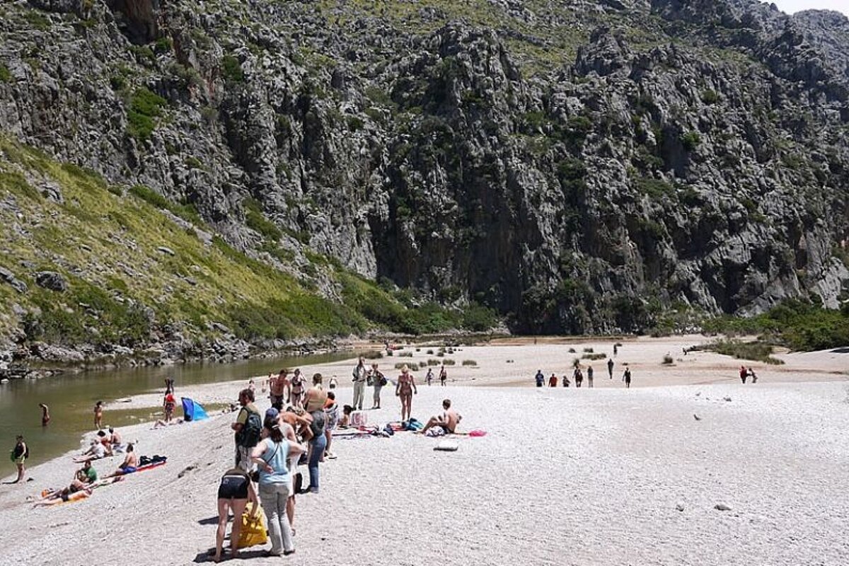 photo of a pebble beach and cliffs