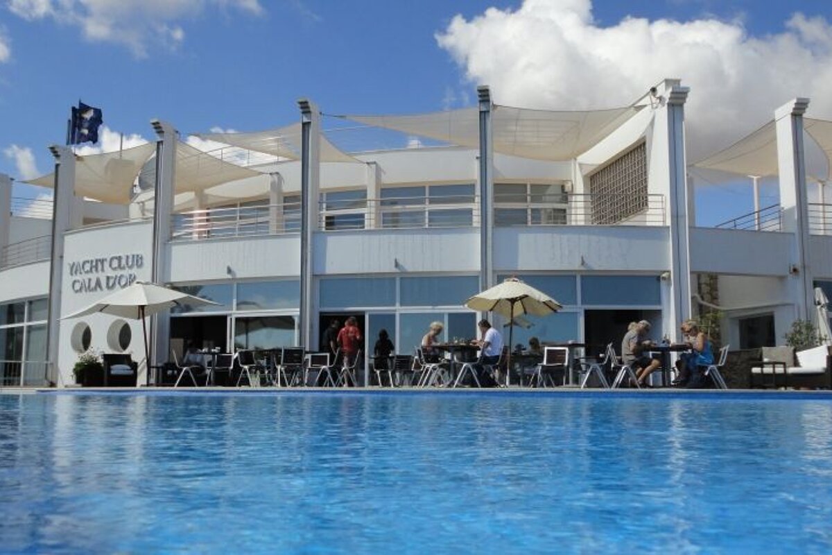 photo of yacht club with pool in foreground