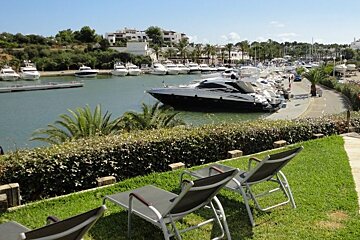 photo of yacht club grounds with sun loungers