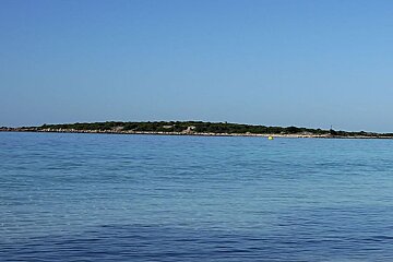 photo of an island and sea