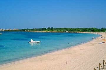 Quiet beach with boat in the water