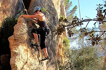 image of a girl rock climbing