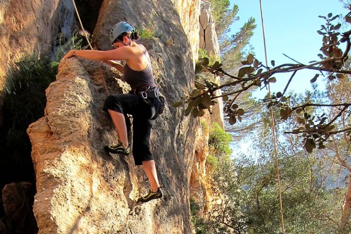 image of a girl rock climbing