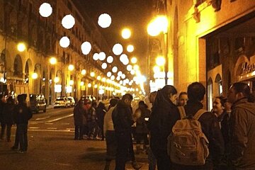 photo of people in a street at night
