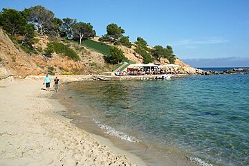 photo of a beach and sea and a beach bar