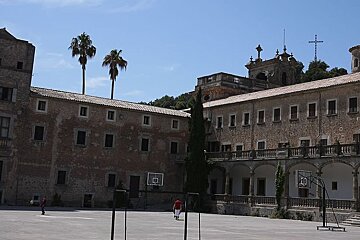a photo of a large courtyard and buildings